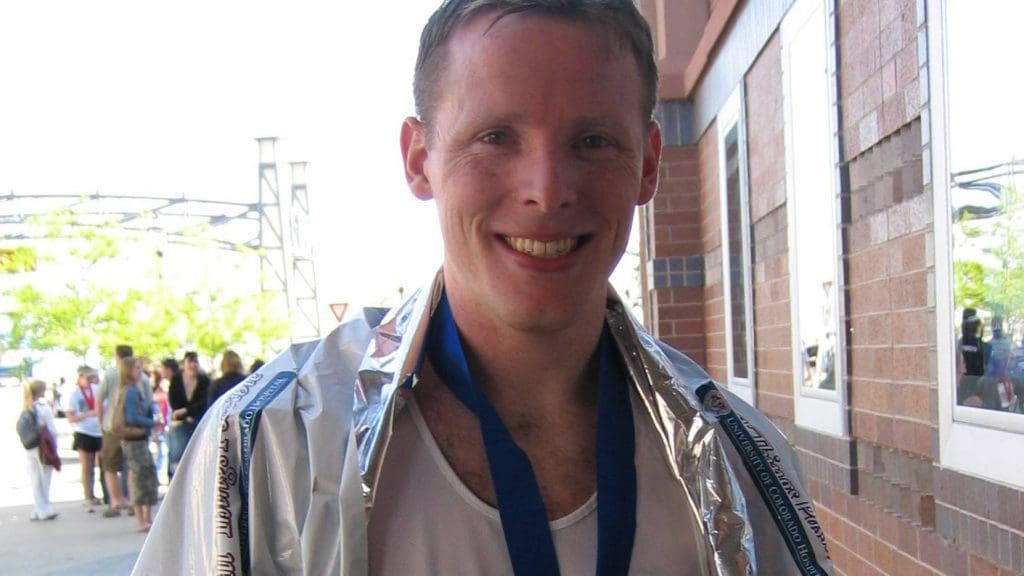 Jeff Helfrich following a race with a medal around his neck